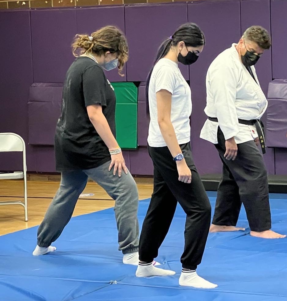 Sensei Rosas working with two new students on footwork